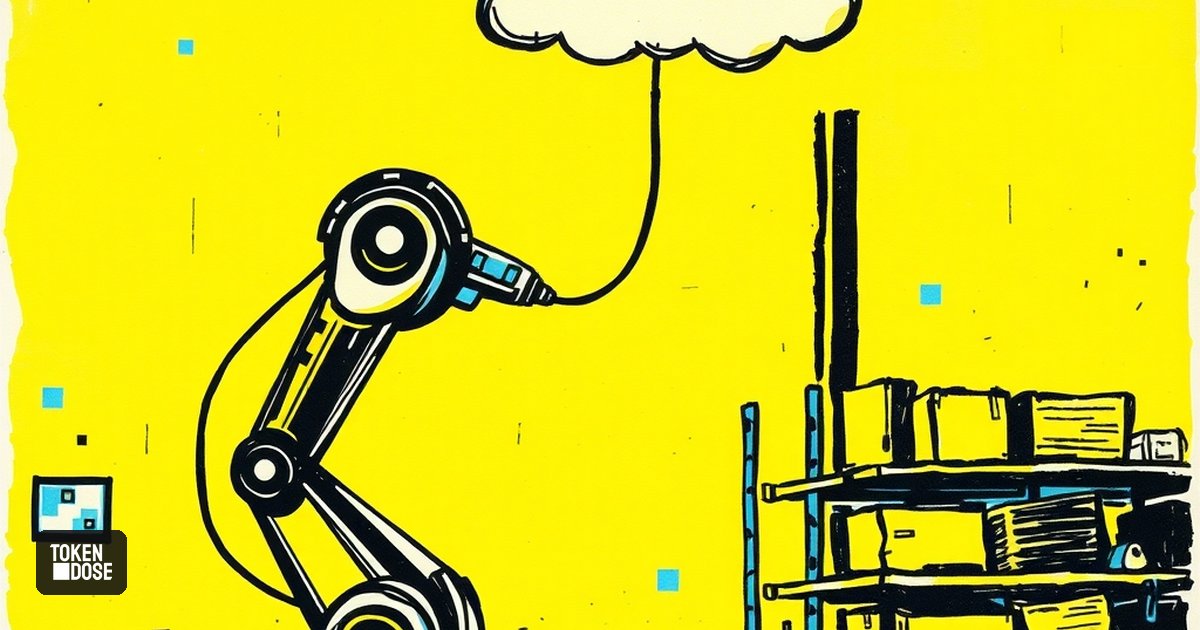 Un bras robotisé dans un entrepôt, relié par un câble à un nuage, avec une barrière de sécurité jaune au sol